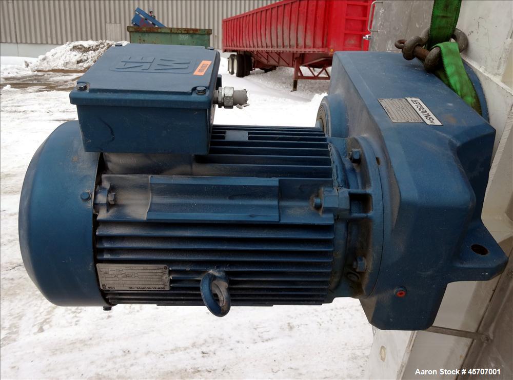 Used Bright Sheet Metal Tank, Approximately 4,000 Gallon, 304 Stainless Steel, Vertical. 100" diameter x 120" straight side. Flat top, coned bottom. 34" x 32" top hinged manway cover, 2" center botto...