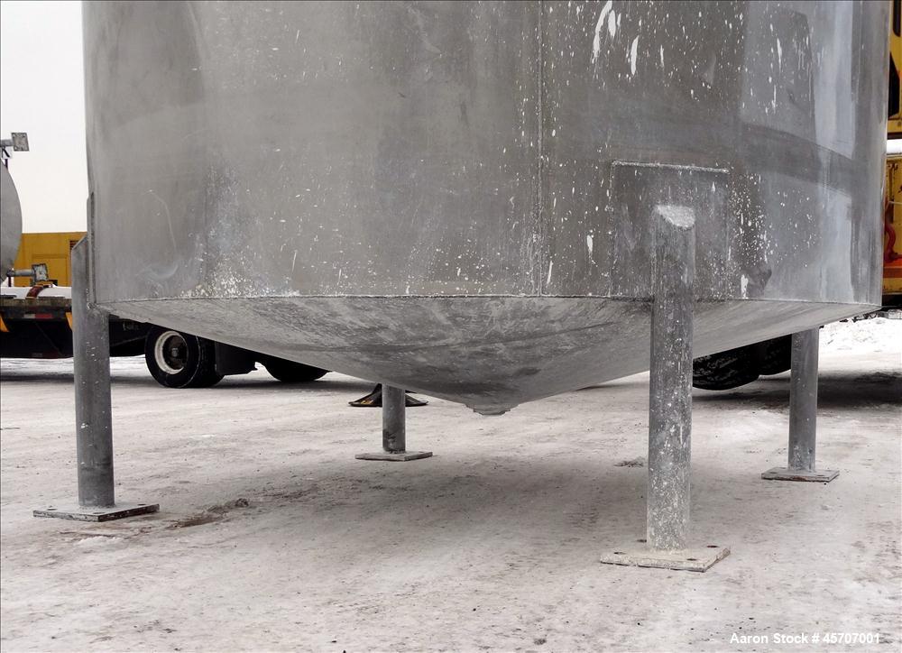Used Bright Sheet Metal Tank, Approximately 4,000 Gallon, 304 Stainless Steel, Vertical. 100" diameter x 120" straight side. Flat top, coned bottom. 34" x 32" top hinged manway cover, 2" center botto...