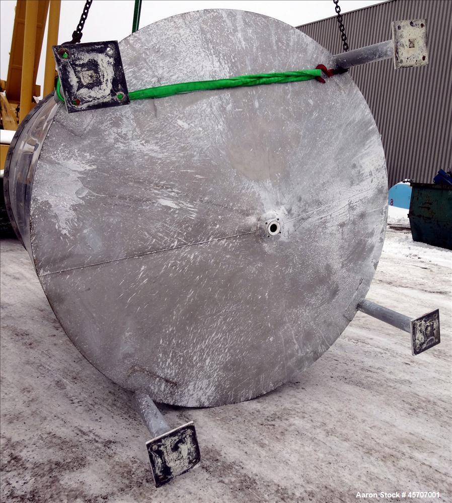 Used Bright Sheet Metal Tank, Approximately 4,000 Gallon, 304 Stainless Steel, Vertical. 100" diameter x 120" straight side. Flat top, coned bottom. 34" x 32" top hinged manway cover, 2" center botto...