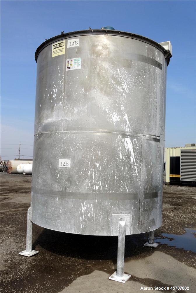 Used Bright Sheet Metal Tank, Approximately 4,000 Gallon, 304 Stainless Steel, Vertical. 100" diameter x 120" straight side. Flat top, coned bottom. 34" x 32" top hinged manway cover, 2" center botto...