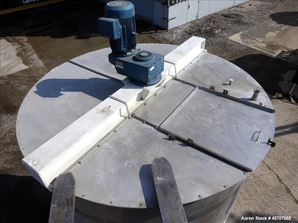 Used Bright Sheet Metal Tank, Approximately 4,000 Gallon, 304 Stainless Steel, Vertical. 100" diameter x 120" straight side. Flat top, coned bottom. 34" x 32" top hinged manway cover, 2" center botto...