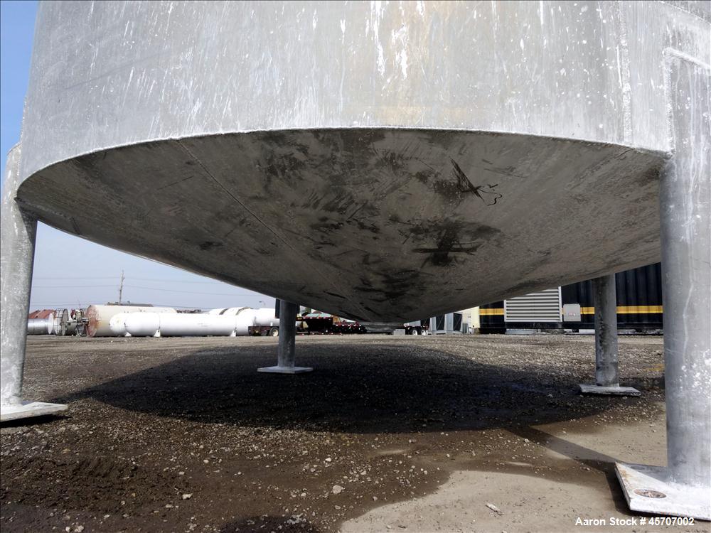 Used Bright Sheet Metal Tank, Approximately 4,000 Gallon, 304 Stainless Steel, Vertical. 100" diameter x 120" straight side. Flat top, coned bottom. 34" x 32" top hinged manway cover, 2" center botto...