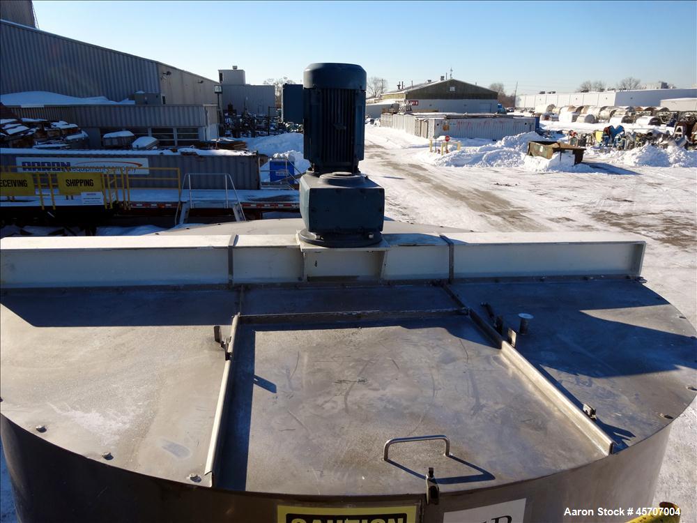 Used Bright Sheet Metal Tank, Approximately 4,000 Gallon, 304 Stainless Steel, Vertical. 100" diameter x 120" straight side. Flat top, coned bottom. 34" x 32" top hinged manway cover, 2" center botto...