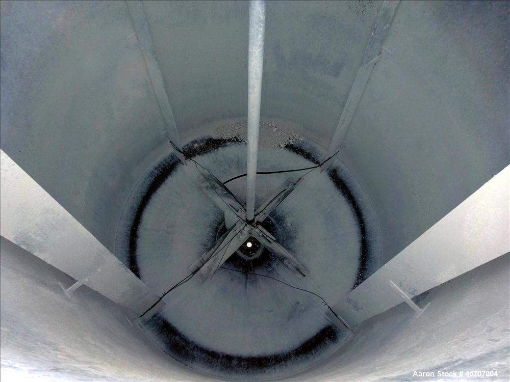 Used Bright Sheet Metal Tank, Approximately 4,000 Gallon, 304 Stainless Steel, Vertical. 100" diameter x 120" straight side. Flat top, coned bottom. 34" x 32" top hinged manway cover, 2" center botto...