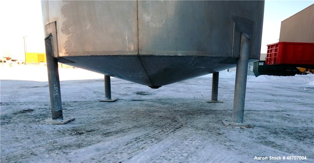 Used Bright Sheet Metal Tank, Approximately 4,000 Gallon, 304 Stainless Steel, Vertical. 100" diameter x 120" straight side. Flat top, coned bottom. 34" x 32" top hinged manway cover, 2" center botto...