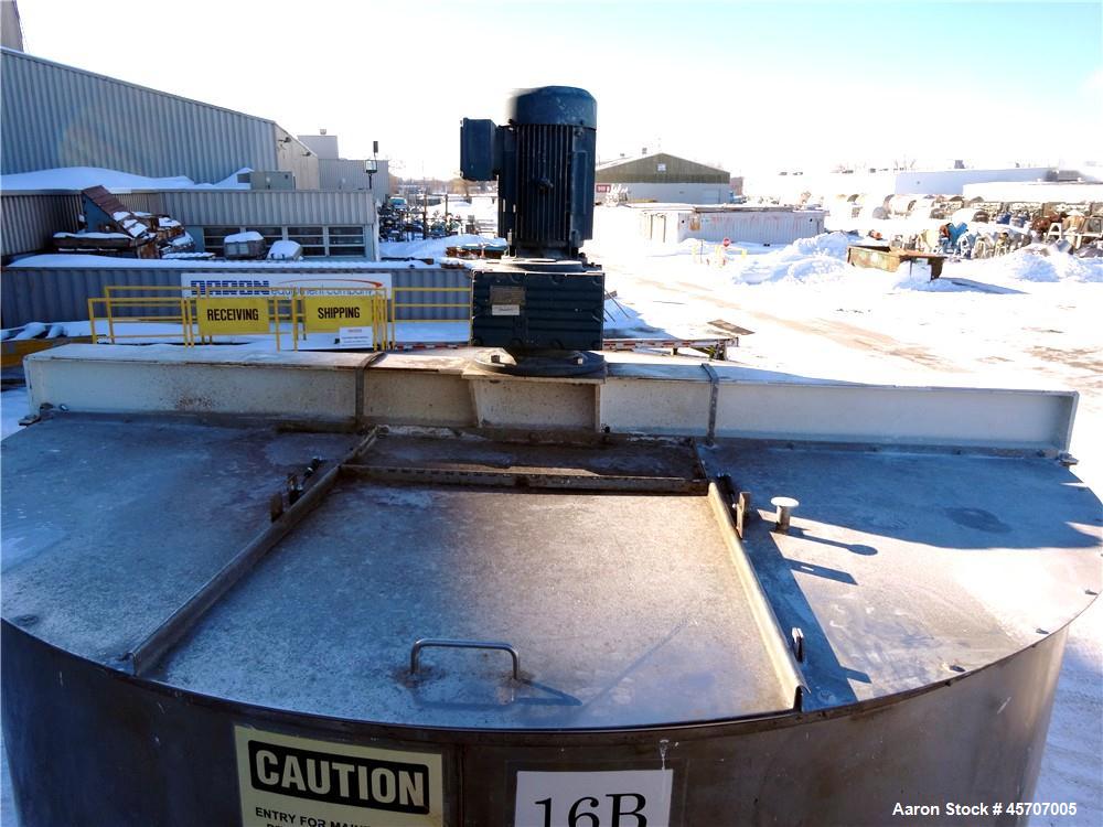 Used Bright Sheet Metal Tank, Approximately 4,000 Gallon, 304 Stainless Steel, Vertical. 100" diameter x 120" straight side. Flat top, coned bottom. 34" x 32" top hinged manway cover, 2" center botto...