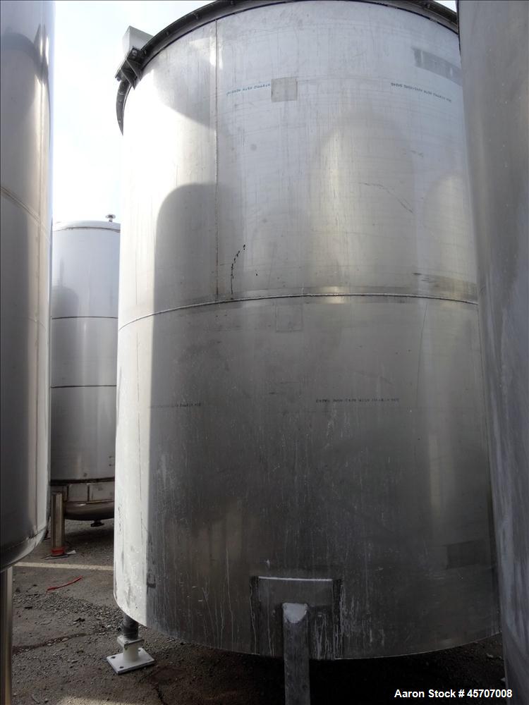 Used Bright Sheet Metal Tank, Approximately 4,000 Gallon, 304 Stainless Steel, Vertical. 100" diameter x 120" straight side. Flat top, coned bottom. 34" x 32" top hinged manway cover, 2" center botto...