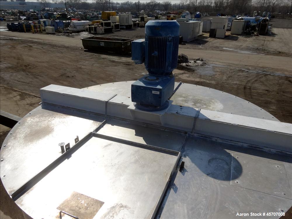 Used Bright Sheet Metal Tank, Approximately 4,000 Gallon, 304 Stainless Steel, Vertical. 100" diameter x 120" straight side. Flat top, coned bottom. 34" x 32" top hinged manway cover, 2" center botto...