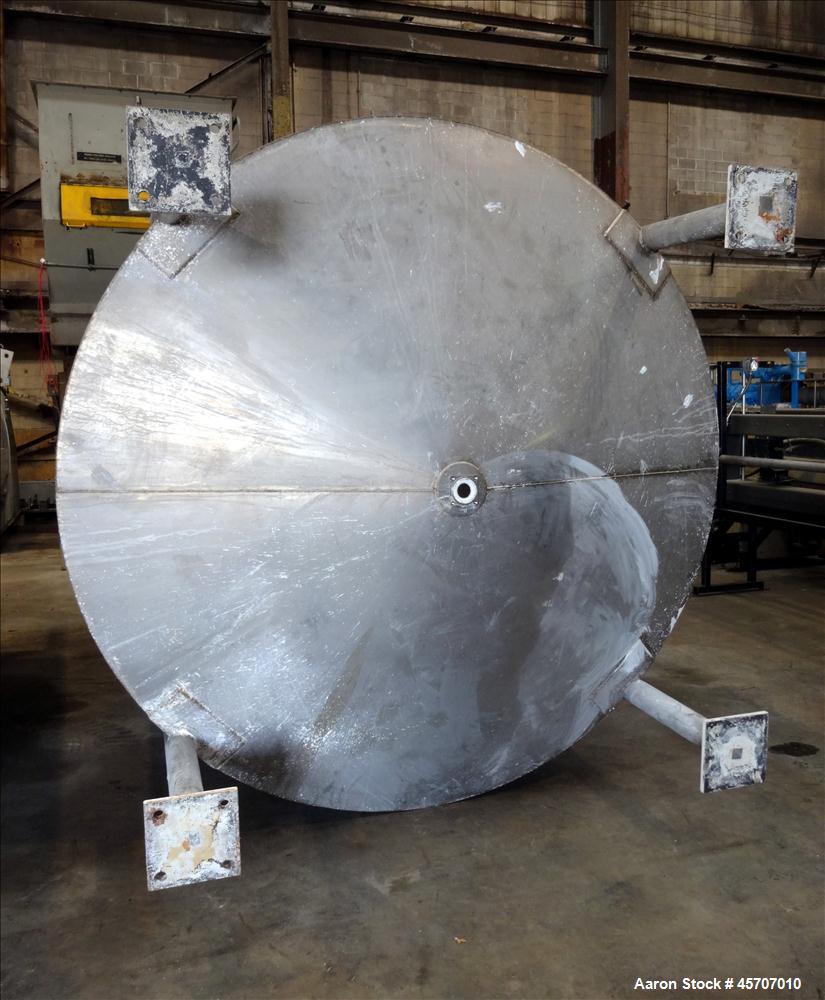 Used Bright Sheet Metal Tank, Approximately 4,000 Gallon, 304 Stainless Steel, Vertical. 100" diameter x 120" straight side. Flat top, coned bottom. 34" x 32" top hinged manway cover, 2" center botto...