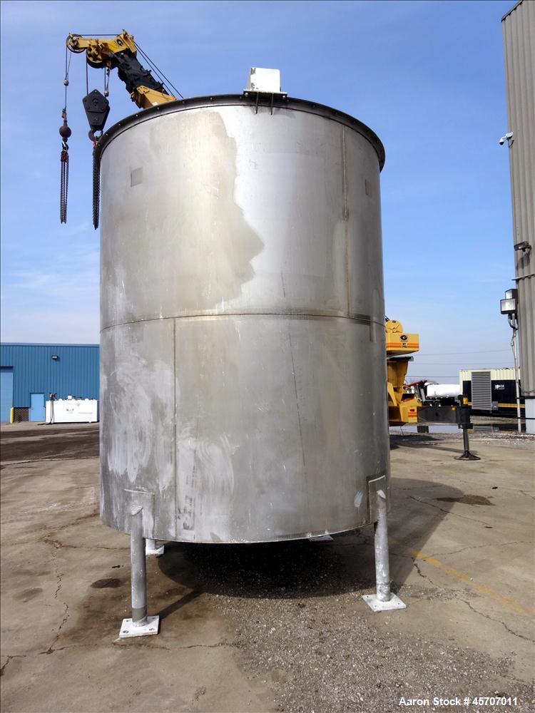 Used Bright Sheet Metal Tank, Approximately 4,000 Gallon, 304 Stainless Steel, Vertical. 100" diameter x 120" straight side. Flat top, coned bottom. 34" x 32" top hinged manway cover, 2" center botto...