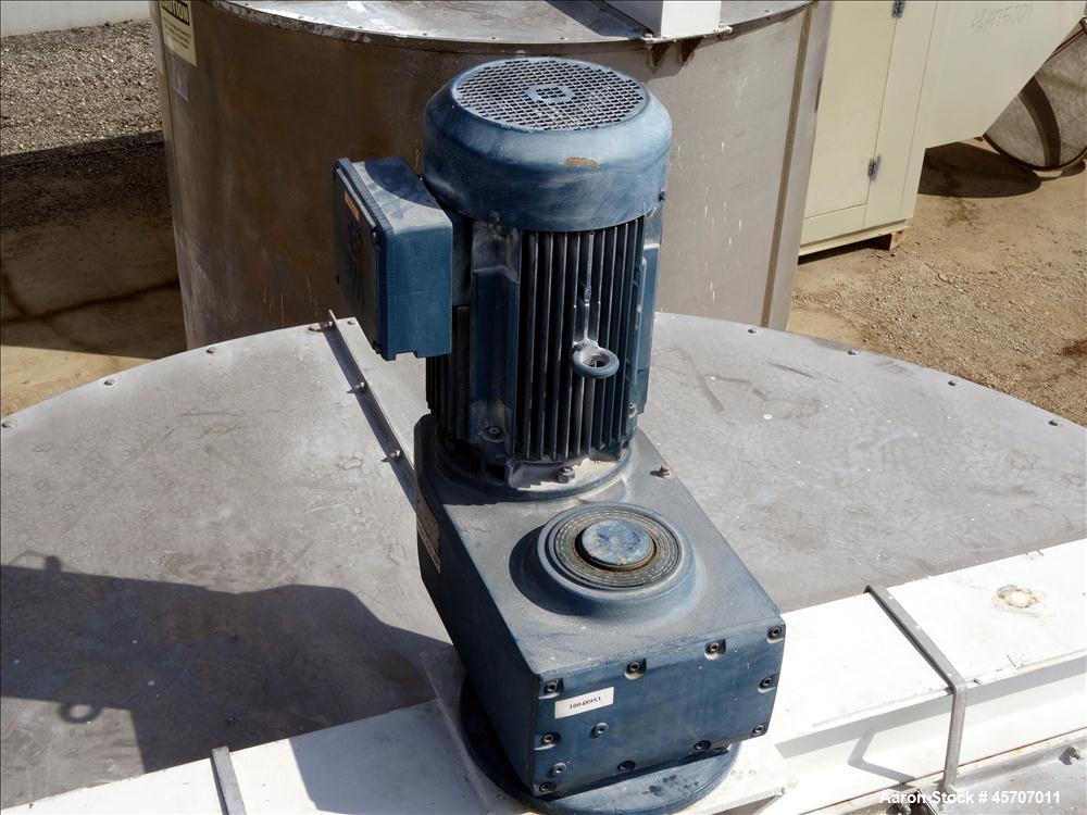 Used Bright Sheet Metal Tank, Approximately 4,000 Gallon, 304 Stainless Steel, Vertical. 100" diameter x 120" straight side. Flat top, coned bottom. 34" x 32" top hinged manway cover, 2" center botto...