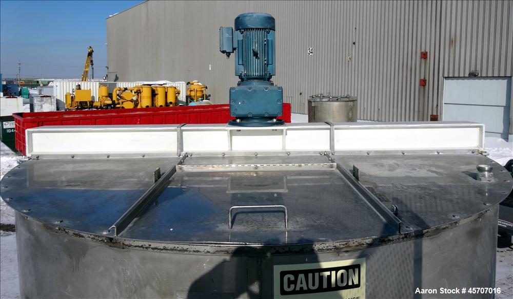 Used Bright Sheet Metal Tank, Approximately 4,000 Gallon, 304 Stainless Steel, Vertical. 100" diameter x 120" straight side. Flat top, coned bottom. 34" x 32" top hinged manway cover, 2" center botto...