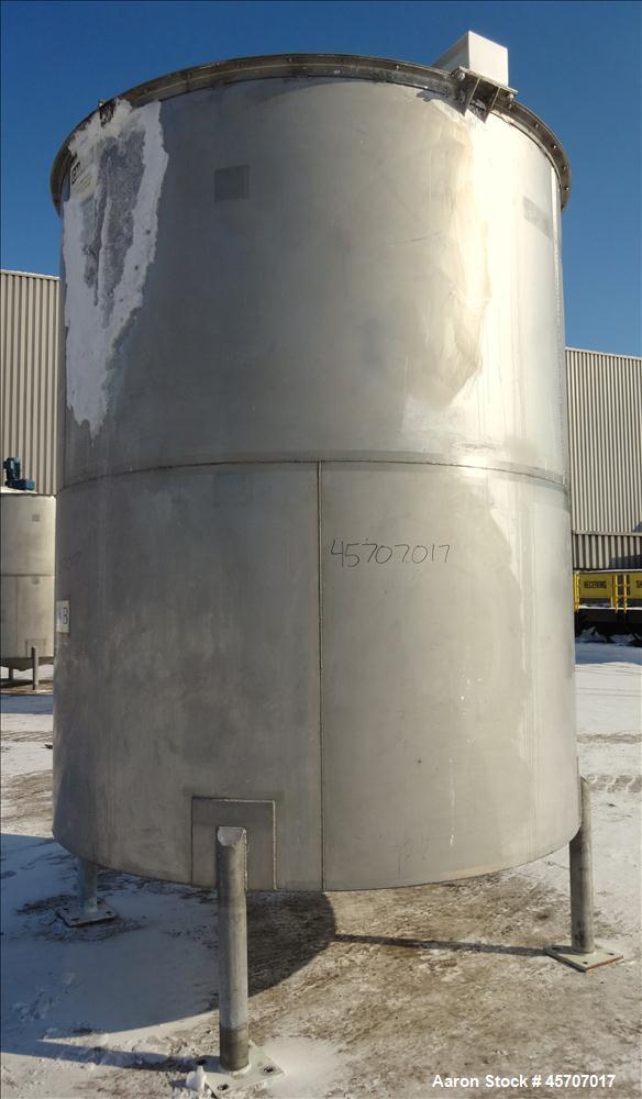 Used Bright Sheet Metal Tank, Approximately 4,000 Gallon, 304 Stainless Steel, Vertical. 100" diameter x 120" straight side. Flat top, coned bottom. 34" x 32" top hinged manway cover, 2" center botto...