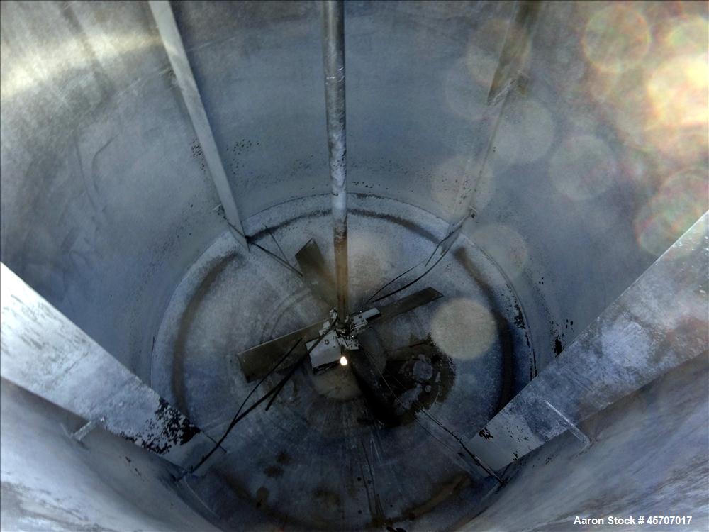 Used Bright Sheet Metal Tank, Approximately 4,000 Gallon, 304 Stainless Steel, Vertical. 100" diameter x 120" straight side. Flat top, coned bottom. 34" x 32" top hinged manway cover, 2" center botto...