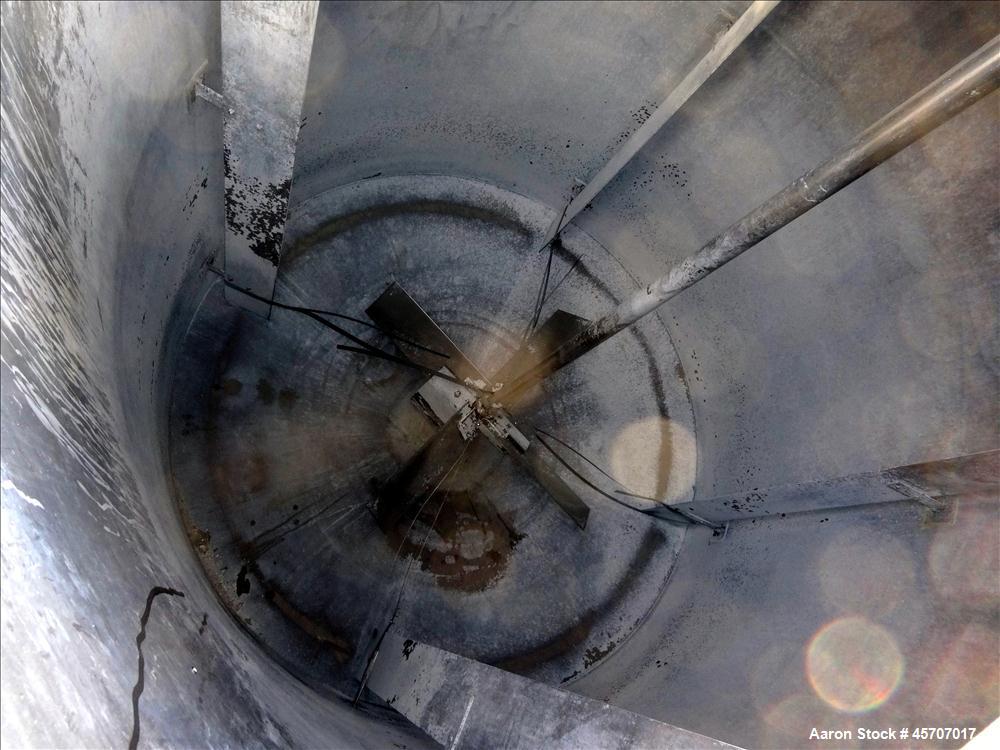 Used Bright Sheet Metal Tank, Approximately 4,000 Gallon, 304 Stainless Steel, Vertical. 100" diameter x 120" straight side. Flat top, coned bottom. 34" x 32" top hinged manway cover, 2" center botto...