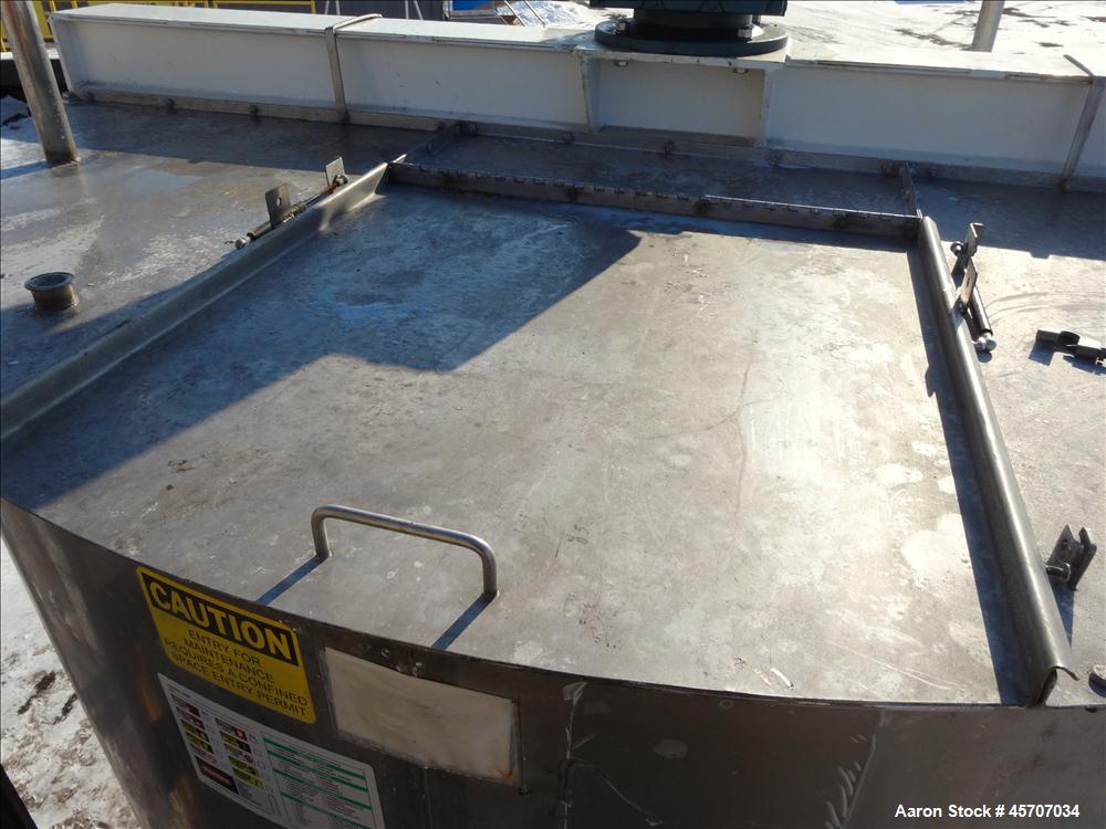 Used- Bright Sheet Metal Tank, Approximately 4,000 Gallon, 304 Stainless Steel, 