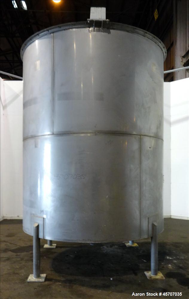 Used Bright Sheet Metal Tank, Approximately 4,000 Gallon, 304 Stainless Steel. 100" diameter x 120" straight side. Cone bottom. 2" center bottom outlet, 34" X 32" top hinged manway cover. (4) Interna...