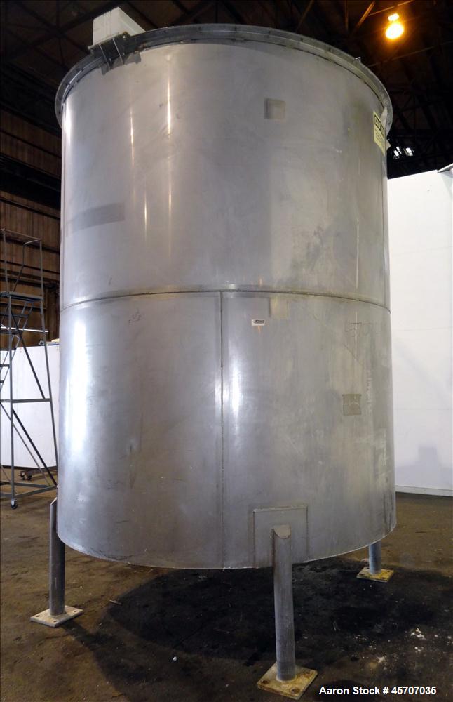 Used Bright Sheet Metal Tank, Approximately 4,000 Gallon, 304 Stainless Steel. 100" diameter x 120" straight side. Cone bottom. 2" center bottom outlet, 34" X 32" top hinged manway cover. (4) Interna...