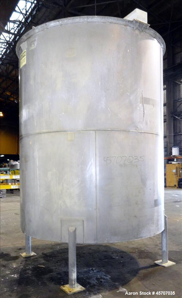Used Bright Sheet Metal Tank, Approximately 4,000 Gallon, 304 Stainless Steel. 100" diameter x 120" straight side. Cone bottom. 2" center bottom outlet, 34" X 32" top hinged manway cover. (4) Interna...
