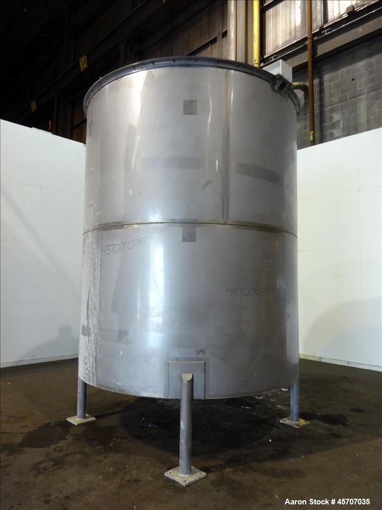 Used Bright Sheet Metal Tank, Approximately 4,000 Gallon, 304 Stainless Steel. 100" diameter x 120" straight side. Cone bottom. 2" center bottom outlet, 34" X 32" top hinged manway cover. (4) Interna...