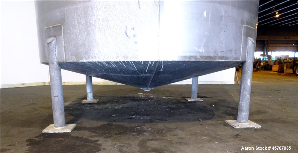 Used Bright Sheet Metal Tank, Approximately 4,000 Gallon, 304 Stainless Steel. 100" diameter x 120" straight side. Cone bottom. 2" center bottom outlet, 34" X 32" top hinged manway cover. (4) Interna...