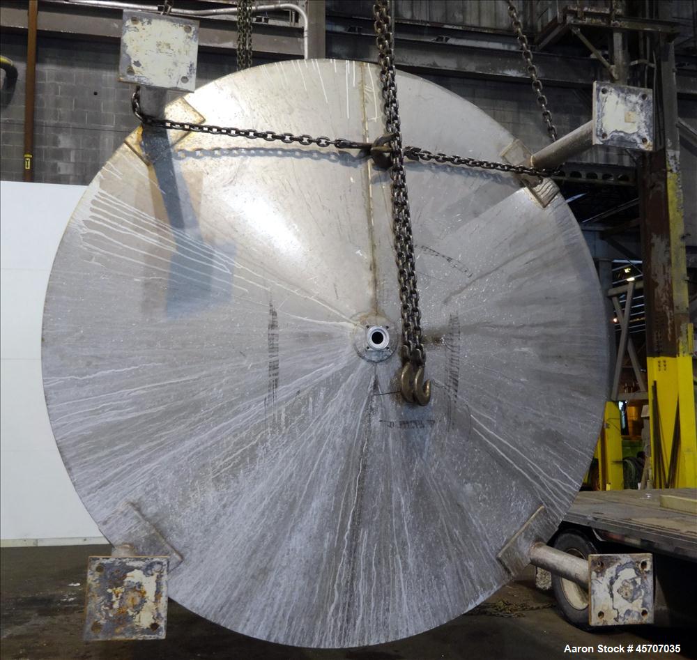 Used Bright Sheet Metal Tank, Approximately 4,000 Gallon, 304 Stainless Steel. 100" diameter x 120" straight side. Cone bottom. 2" center bottom outlet, 34" X 32" top hinged manway cover. (4) Interna...