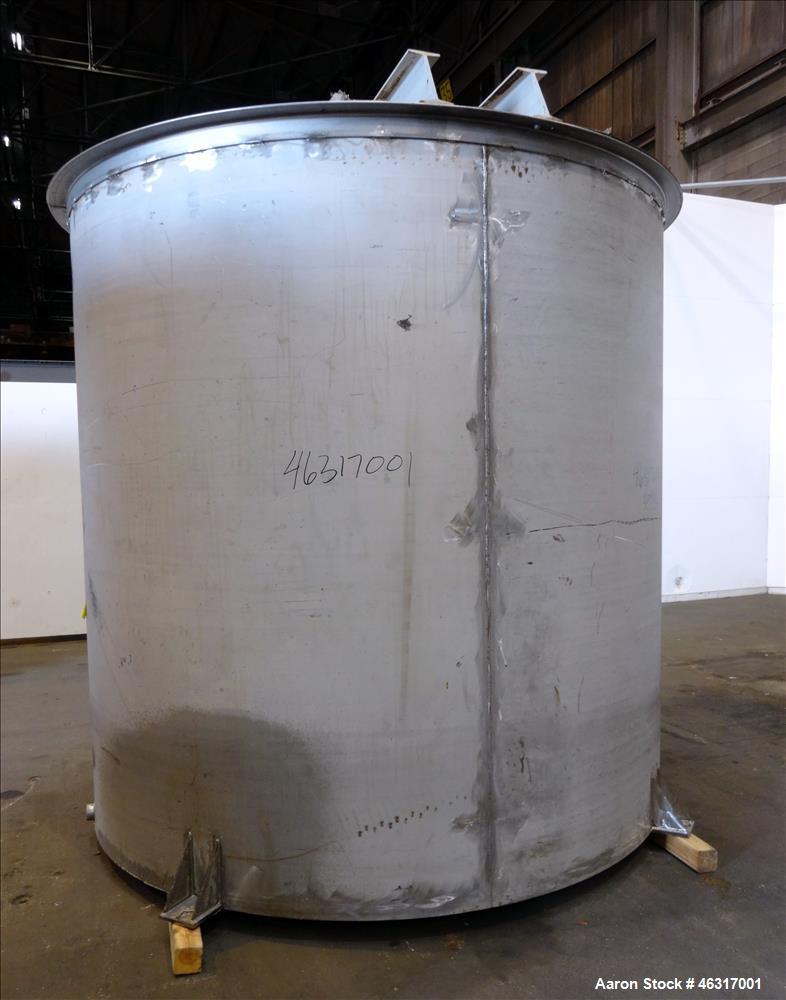 Unused- Tank, Approximately 3,000 Gallon, 304 Stainless steel, Vertical. Approximately 102" diameter x 99" straight side. Flat top with hinged covers, sloped bottom. Top bolt on bridge mounted agitat...