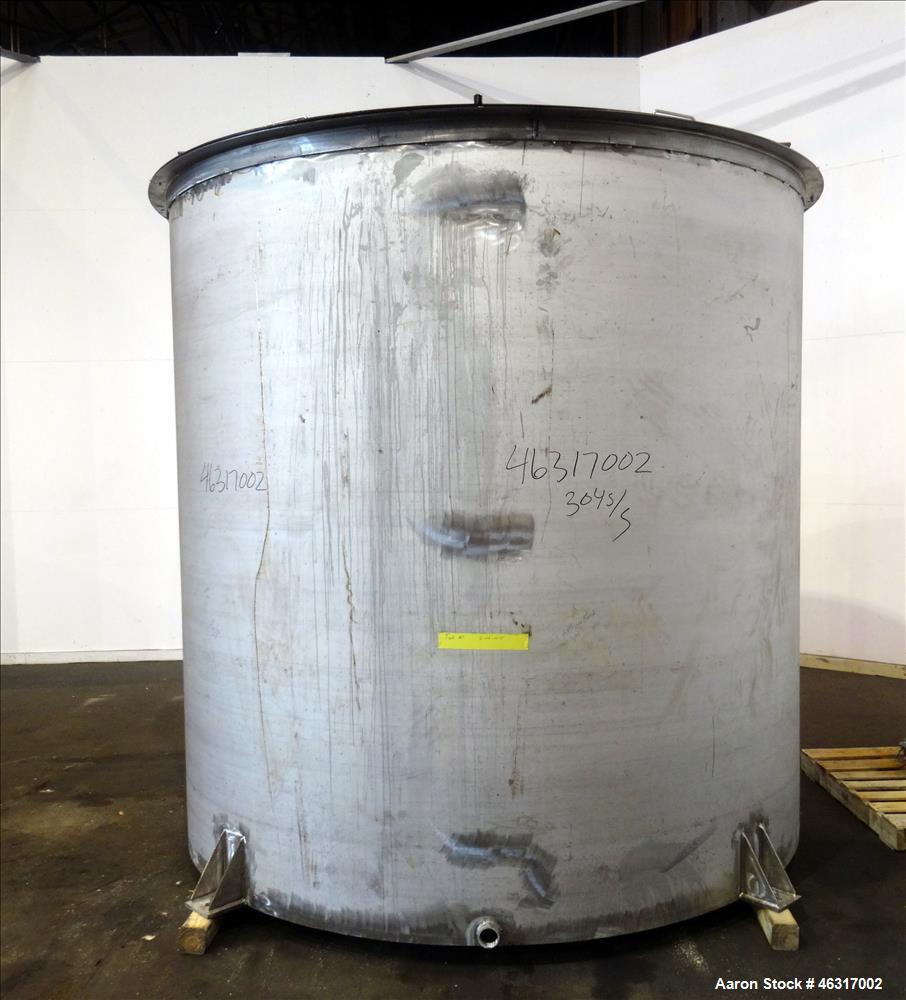 Unused- Tank, Approximately 3,000 Gallon, 304 Stainless steel, Vertical. Approximately 102" diameter x 99" straight side. Flat top with hinged covers, sloped bottom. Top bolt on carbon steel agitator...