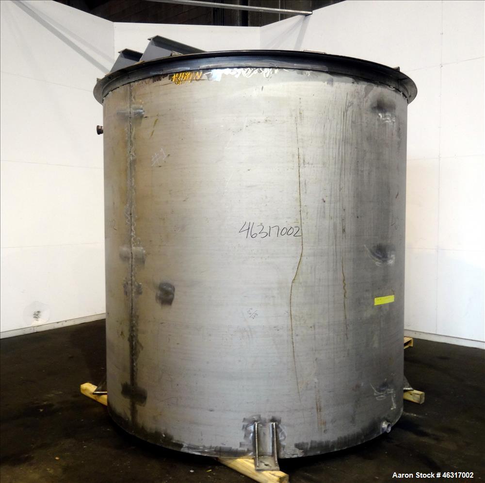 Unused- Tank, Approximately 3,000 Gallon, 304 Stainless steel, Vertical. Approximately 102" diameter x 99" straight side. Flat top with hinged covers, sloped bottom. Top bolt on carbon steel agitator...