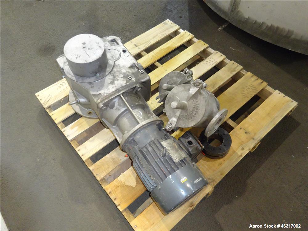 Unused- Tank, Approximately 3,000 Gallon, 304 Stainless steel, Vertical. Approximately 102" diameter x 99" straight side. Flat top with hinged covers, sloped bottom. Top bolt on carbon steel agitator...