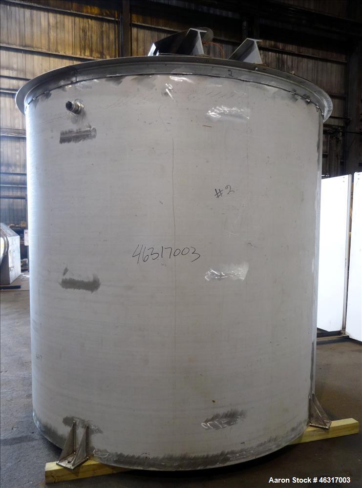 Unused- Tank, Approximately 3,000 Gallon, 304 Stainless steel, Vertical. Approximately 102" diameter x 99" straight side. Flat top with hinged covers, sloped bottom. Top bolt on carbon steel agitator...
