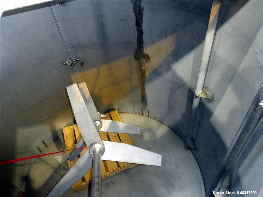Unused- Tank, Approximately 3,000 Gallon, 304 Stainless steel, Vertical. Approximately 102" diameter x 99" straight side. Flat top with hinged covers, sloped bottom. Top bolt on carbon steel agitator...