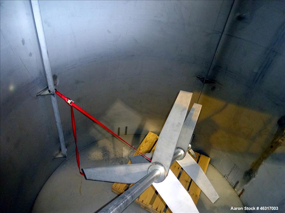 Unused- Tank, Approximately 3,000 Gallon, 304 Stainless steel, Vertical. Approximately 102" diameter x 99" straight side. Flat top with hinged covers, sloped bottom. Top bolt on carbon steel agitator...