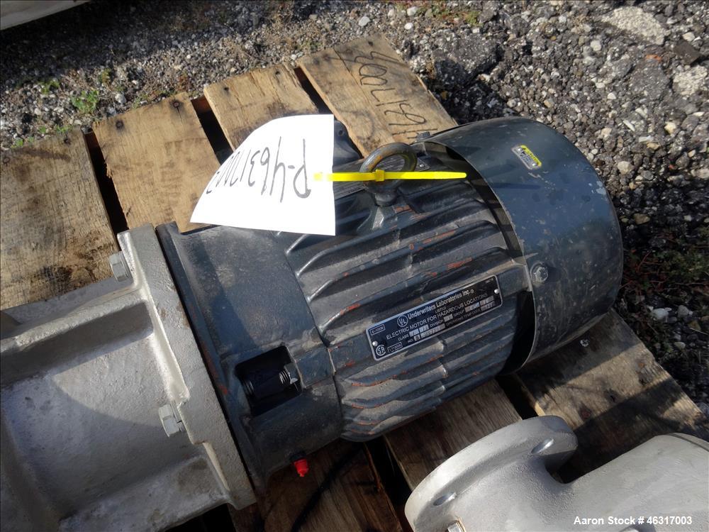 Unused- Tank, Approximately 3,000 Gallon, 304 Stainless steel, Vertical. Approximately 102" diameter x 99" straight side. Flat top with hinged covers, sloped bottom. Top bolt on carbon steel agitator...