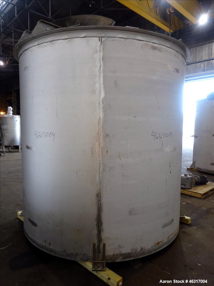 Unused- Tank, Approximately 3,000 Gallon, 304 Stainless steel, Vertical. Approximately 102" diameter x 99" straight side. Flat top with hinged covers, sloped bottom. Top bolt on bridge mounted agitat...