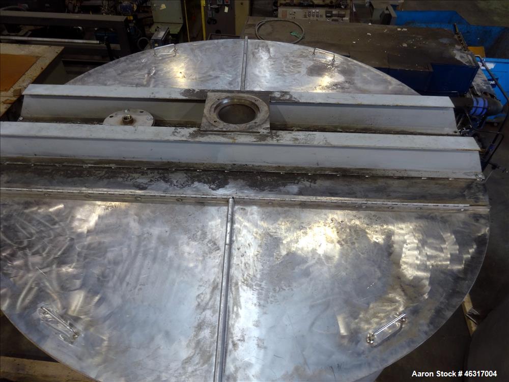 Unused- Tank, Approximately 3,000 Gallon, 304 Stainless steel, Vertical. Approximately 102" diameter x 99" straight side. Flat top with hinged covers, sloped bottom. Top bolt on bridge mounted agitat...