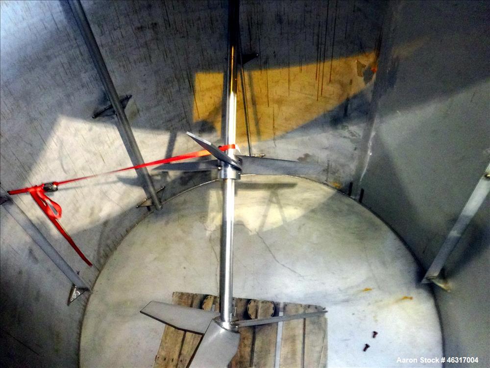 Unused- Tank, Approximately 3,000 Gallon, 304 Stainless steel, Vertical. Approximately 102" diameter x 99" straight side. Flat top with hinged covers, sloped bottom. Top bolt on bridge mounted agitat...
