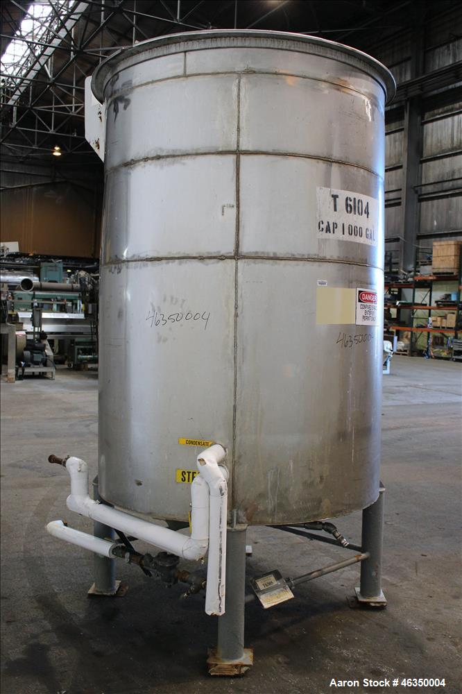 Used Tank, Approximate 1,000 Gallon, 304 Stainless Steel, Vertical. Approximate 60" diameter x 82" straight side. Flat top with hinged covers, flat bottom. Openings side (2) 1-1/2" threaded, 1" threa...