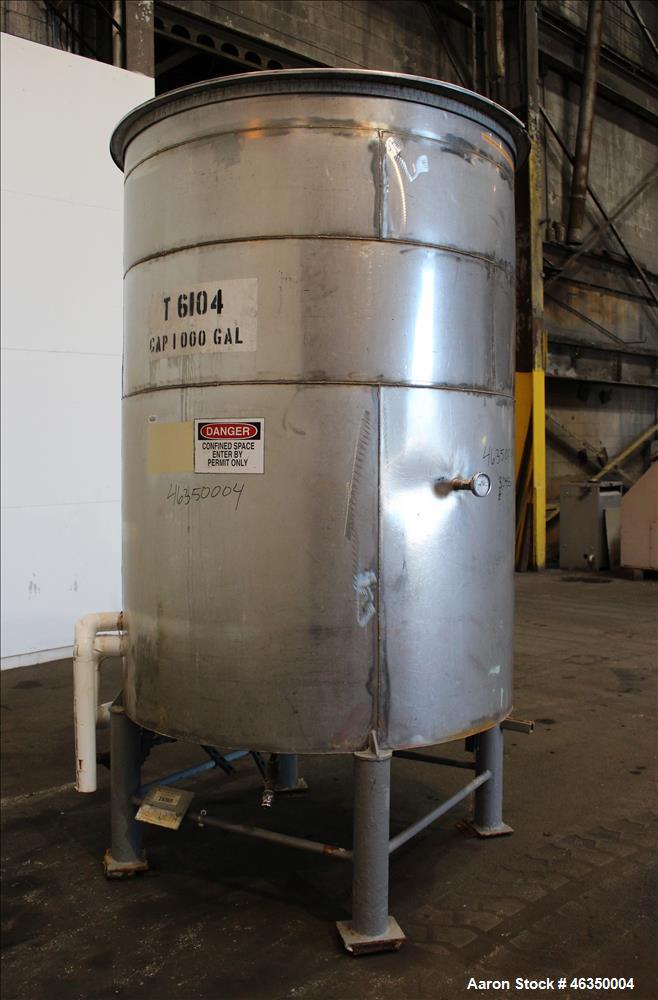 Used Tank, Approximate 1,000 Gallon, 304 Stainless Steel, Vertical. Approximate 60" diameter x 82" straight side. Flat top with hinged covers, flat bottom. Openings side (2) 1-1/2" threaded, 1" threa...