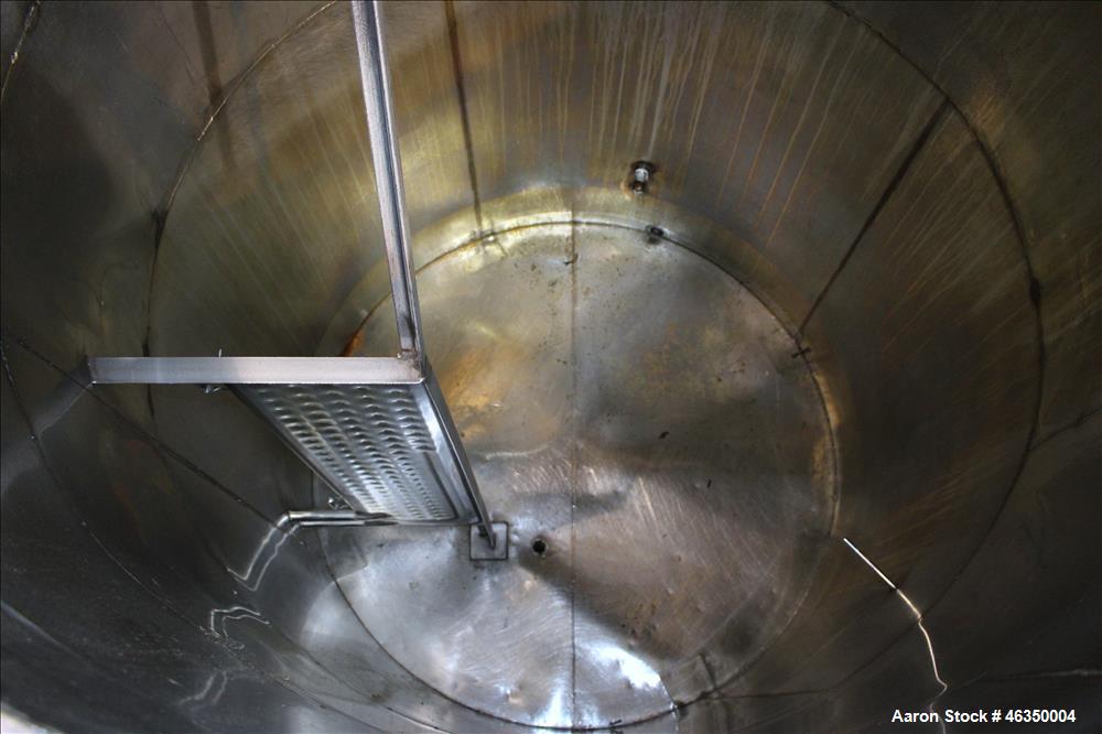 Used Tank, Approximate 1,000 Gallon, 304 Stainless Steel, Vertical. Approximate 60" diameter x 82" straight side. Flat top with hinged covers, flat bottom. Openings side (2) 1-1/2" threaded, 1" threa...