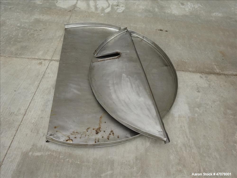 Used Tank, Approximate 1,000 Gallon, 304 Stainless Steel, Vertical. Approximate 56" diameter x 94" straight side. Open top with covers, coned bottom. 2" Center bottom outlet. Mounted on (4) carbon st...