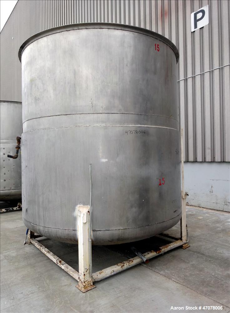 Used Tank, Approximate 4500 Gallon, Stainless Steel, Vertical. Approximate 114" diameter x 106" straight side. Open top with lift off cover, dished bottom.  2" Center bottom outlet. Mounted on 4 carb...