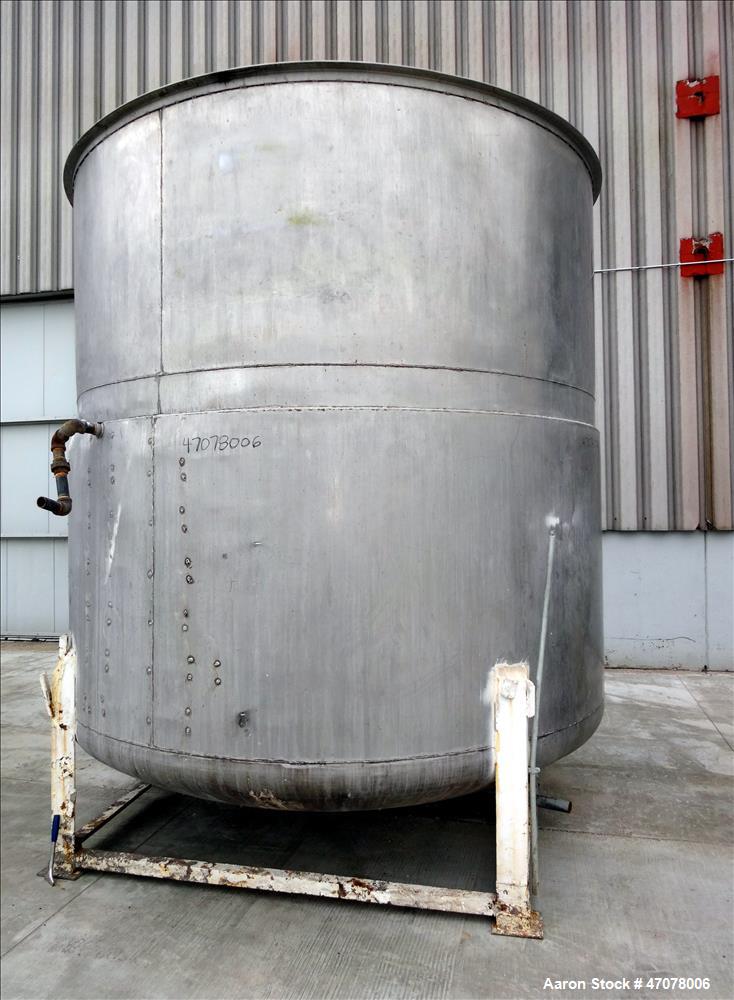 Used Tank, Approximate 4500 Gallon, Stainless Steel, Vertical. Approximate 114" diameter x 106" straight side. Open top with lift off cover, dished bottom.  2" Center bottom outlet. Mounted on 4 carb...