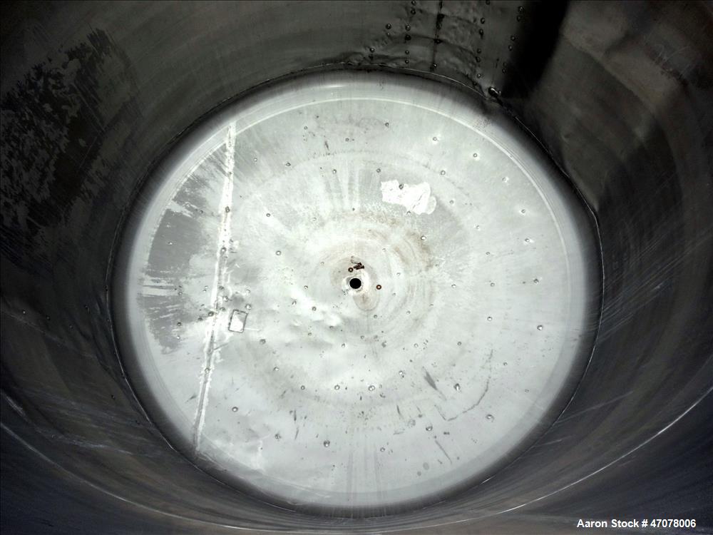 Used Tank, Approximate 4500 Gallon, Stainless Steel, Vertical. Approximate 114" diameter x 106" straight side. Open top with lift off cover, dished bottom.  2" Center bottom outlet. Mounted on 4 carb...