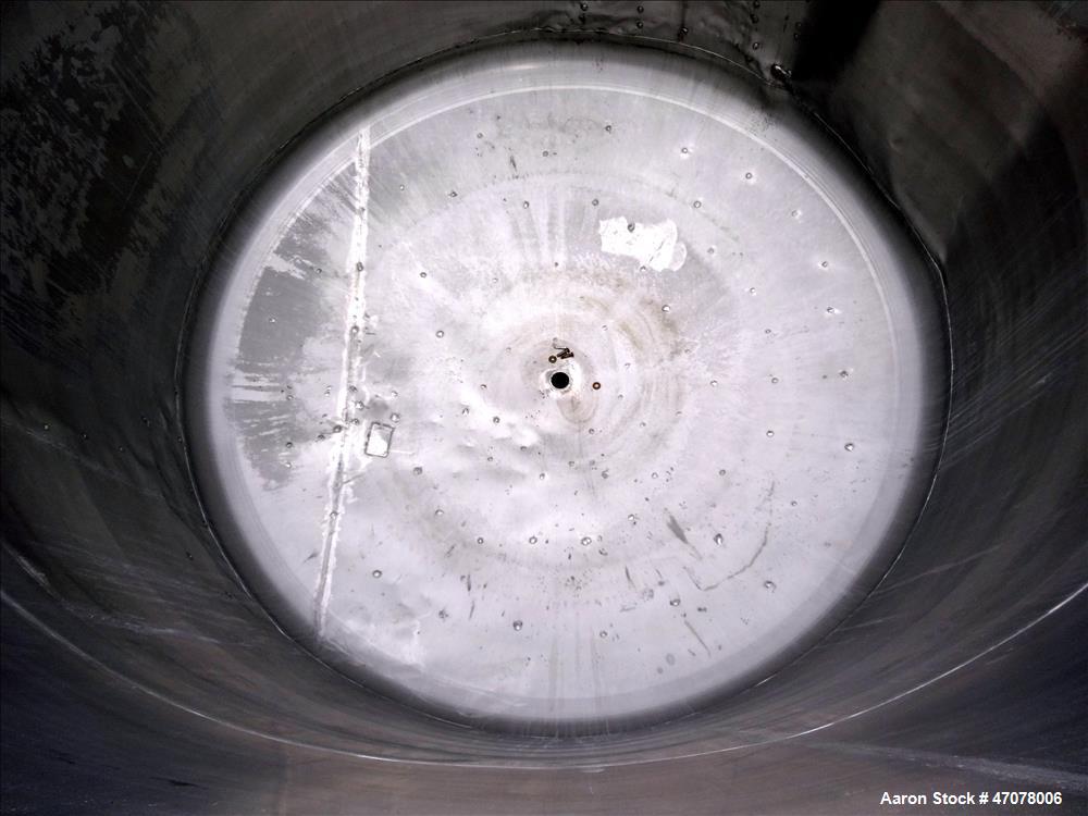 Used Tank, Approximate 4500 Gallon, Stainless Steel, Vertical. Approximate 114" diameter x 106" straight side. Open top with lift off cover, dished bottom.  2" Center bottom outlet. Mounted on 4 carb...