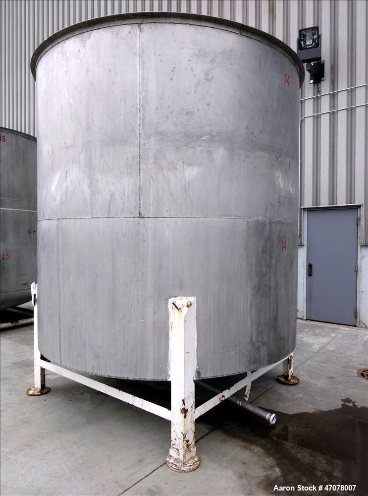 Used Tank, Approximate 4,000 Gallon, 304 Stainless Steel, Vertical. Approximate 108" diameter x 105" straight side. Open top with lift off cover, dished bottom. 2" Center bottom outlet. Mounted on (4...