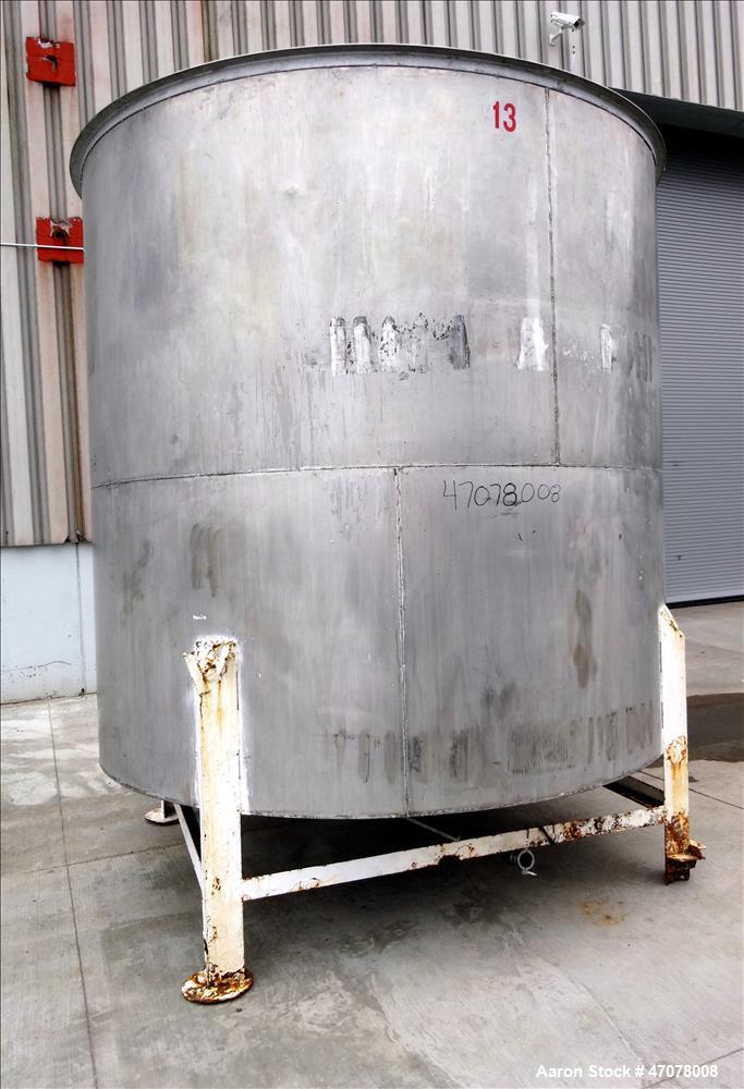 Used Tank, Approximate 4,000 Gallon, 304 Stainless Steel, Vertical. Approximate 108" diameter x 105" straight side. Open top with lift off cover, dished bottom. 2" Center bottom outlet. Mounted on (4...