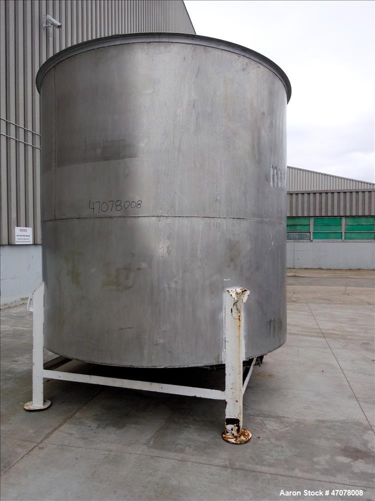 Used Tank, Approximate 4,000 Gallon, 304 Stainless Steel, Vertical. Approximate 108" diameter x 105" straight side. Open top with lift off cover, dished bottom. 2" Center bottom outlet. Mounted on (4...