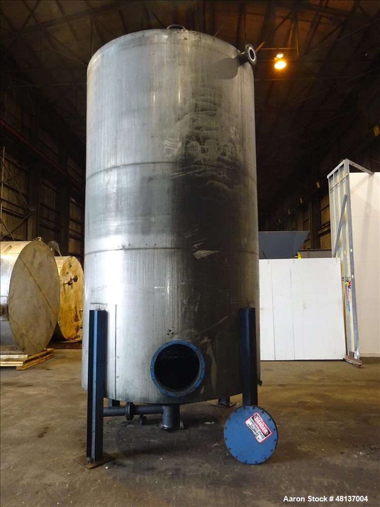 Used Tank, 4,000 Gallon, 304 Stainless steel, Vertical. Approximate 89" diameter x 155" straight side, flat top, cone bottom. Top openings: 3", (2) 4". Side openings: 18" man way with cover, 4", 8" c...