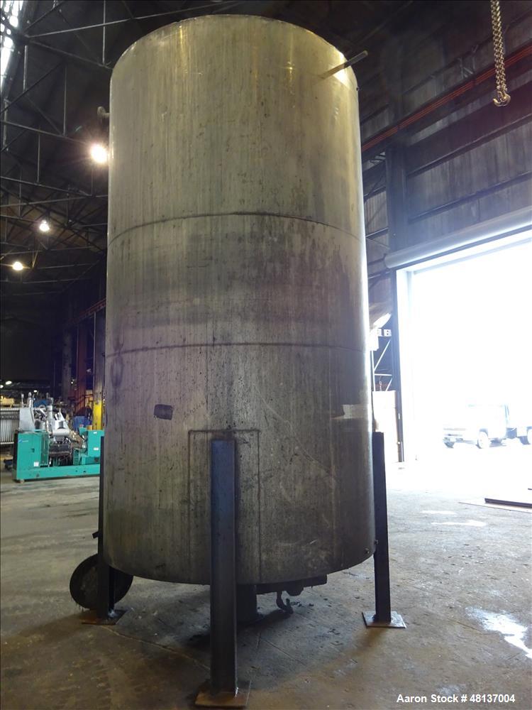 Used Tank, 4,000 Gallon, 304 Stainless steel, Vertical. Approximate 89" diameter x 155" straight side, flat top, cone bottom. Top openings: 3", (2) 4". Side openings: 18" man way with cover, 4", 8" c...